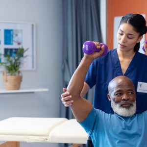 Physiotherapist helping patient